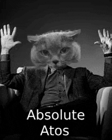 a man in a suit with a cat 's head on his head is sitting in a chair .