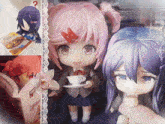 a doll holding a cup of coffee next to two other dolls and a book that says ' gourmet ' on it