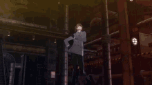a man in a suit is standing in a dark room with pipes