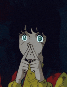 a girl with green eyes making a face with her fingers