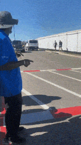 a man wearing a blue shirt that says ' eagle ' on it
