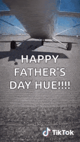 a plane is sitting on a runway with the words `` happy father 's day hue !!! ''