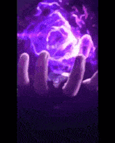 a person holding a purple object in their hands