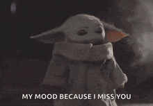 a baby yoda says " my mood because i miss you " in a dark room