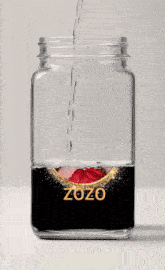 a glass jar with a picture of a woman and the year zozo