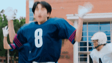 a football player wearing a blue jersey with the number 8