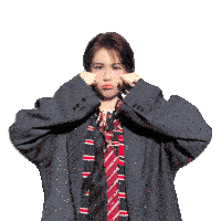 a woman wearing a suit and tie is making a face