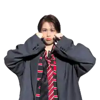a woman wearing a suit and tie is making a face