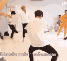 a group of people are dancing in a room with the word lin on the bottom right