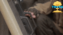a person holding a gun with the word truth in blue letters