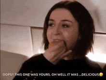 a woman eating a piece of food with the words oops this one was yours oh well it was delicious below her