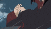 itachi uchiha from naruto is wearing a black and red hooded jacket .