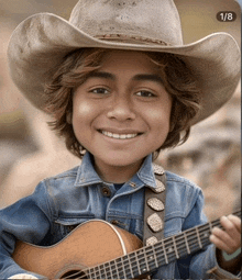 a young boy is wearing a cowboy hat and holding a guitar