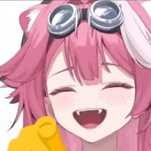 a close up of a pink anime girl wearing goggles and holding a yellow object .