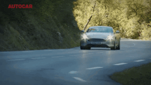 a car with a license plate that says kx82 bvm