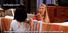 two women are sitting next to each other on a couch and one of them says i 'm not comfortable