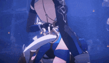 a close up of a person holding a sword in a dark room