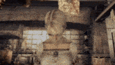 a woman in a white dress stands in a kitchen