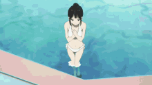a girl in a bikini is standing next to a swimming pool
