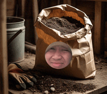 a bag of dirt has a picture of a man 's face in it