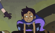 a cartoon character is holding a sword and smiling while sitting next to another character .