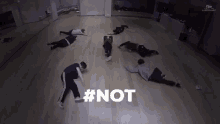 a group of people are laying on the floor in a dance studio with the hashtag # not .