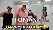 a group of people are celebrating a birthday with the name tomas