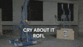 a blue machine with the words cry about it rofl written on it