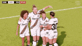 a group of female soccer players are hugging each other and one has the number 30 on her back