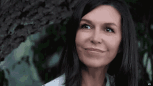 a close up of a woman 's face with the letters ad visible