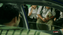 a group of people sitting in a car with the word full on the bottom left