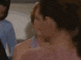 a group of women are standing next to each other and talking in a room .