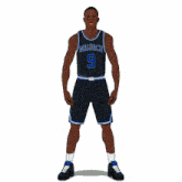 a basketball player with the number 9 on his jersey is pointing up