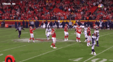 a football game is being played in front of a crowd with the hashtag royals_jun
