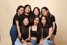 a group of young women pose for a picture together