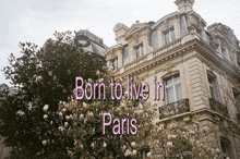 a picture of a building with the words born to live in paris on it