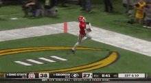 a football game between ohio state and georgia is being played