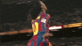 a soccer player wearing a jersey with the number 10 on it