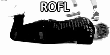 a black and white photo of a person laying on their stomach with the words `` rofl '' written on it .