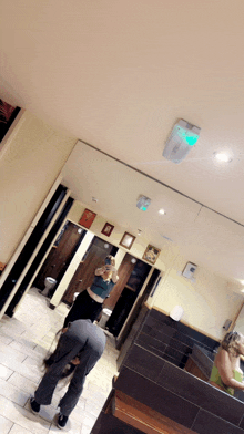 a woman taking a picture of herself in a public restroom