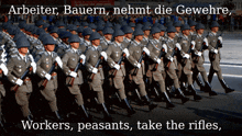a group of soldiers marching with the words arbeiter bauern nehmt die gewehre workers peasants take the rifles