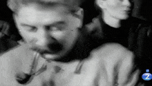 a black and white photo of a man with the number 2 on the bottom