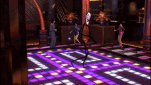 a man and woman are dancing on a dance floor in a club