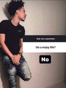 a young man leaning against a wall with a question that says " ask me a question do u enjoy life "