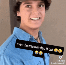 a man in a blue shirt has a sticker that says ' even he was weirded tf out '