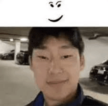 a close up of a man 's face with a smiley face on it .