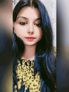 a woman with blue hair is wearing a yellow and black shirt