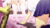 a girl kneeling on a bed with a stuffed giraffe