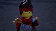 a lego character with a red headband and a sword