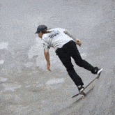 a skateboarder is doing a trick on a ramp while another skateboarder watches